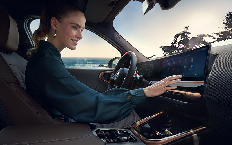 Woman sitting inside of a BMW X3.