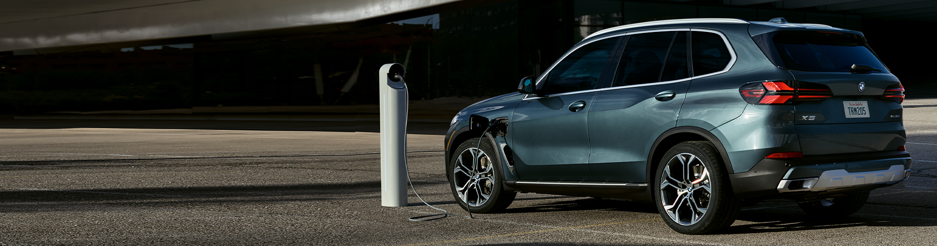 Parked BMW X5 charging