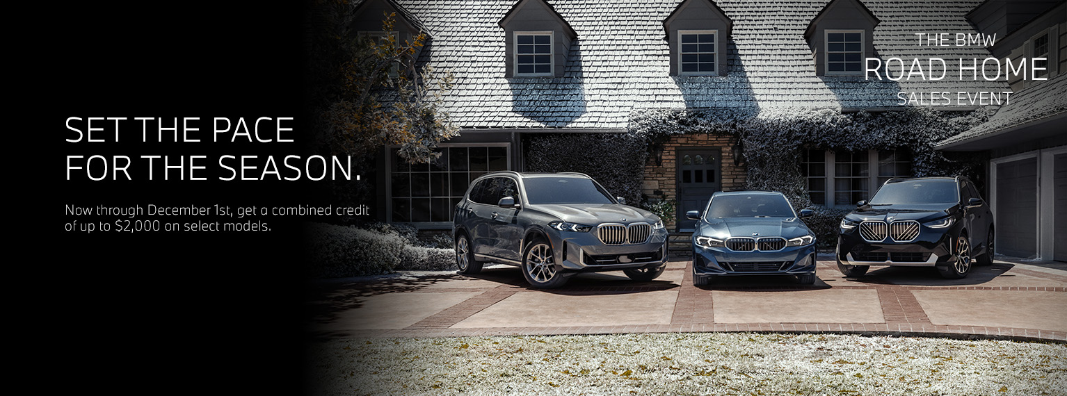 BMW X5, 3 Series, and X3 parked in a driveway of a holiday decorated home.