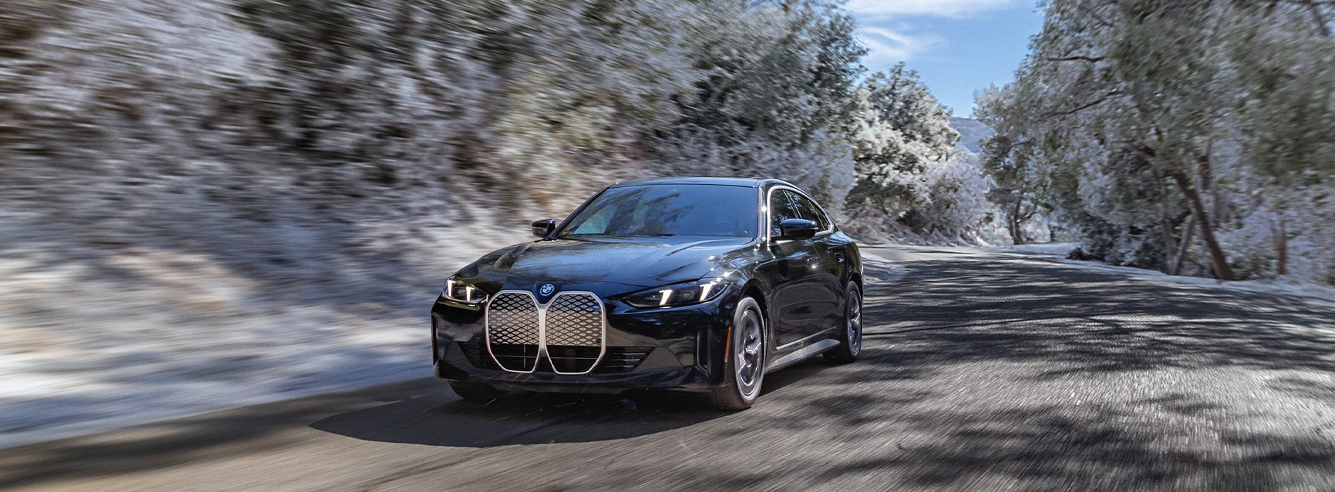 BMW i4 series driving on a road