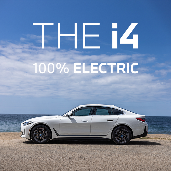 BMW i4 parked at the seaside.