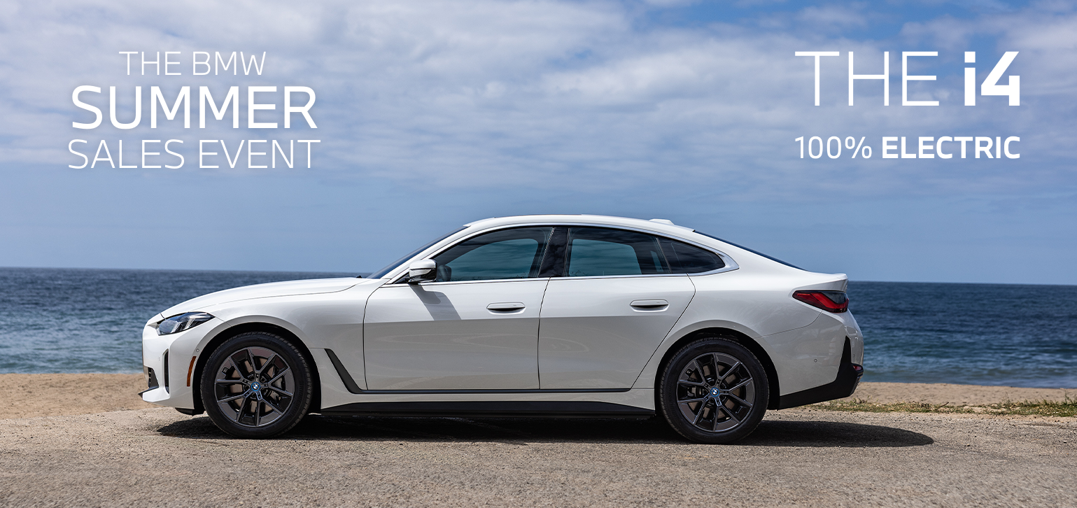 Parked BMW i4 parked on the seaside.