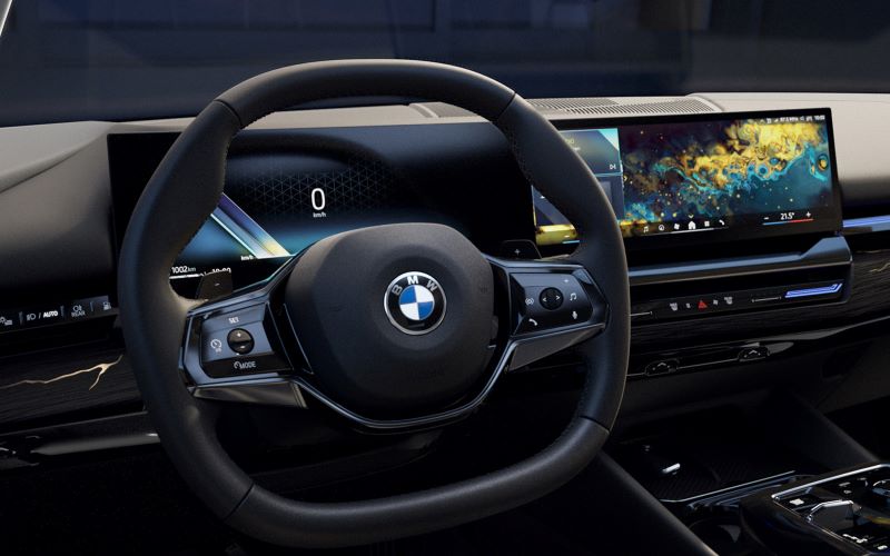 5 series interior with new steering wheel and curved display.