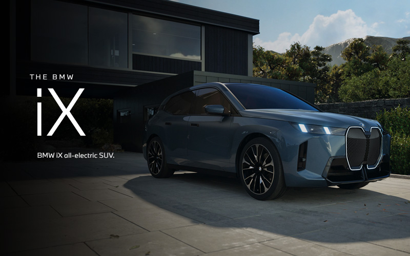 The BMW iX SUV parked. Click to learn more.