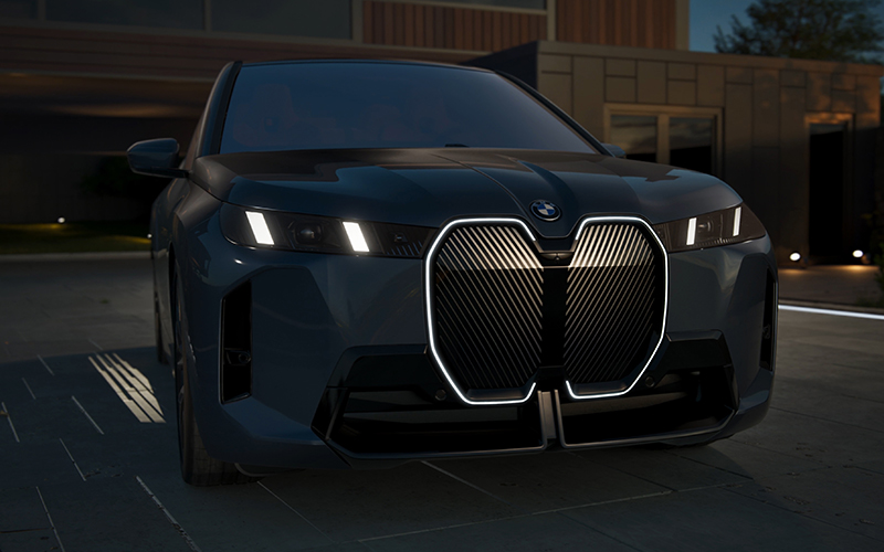 The BMW iX illuminated kidney grille.