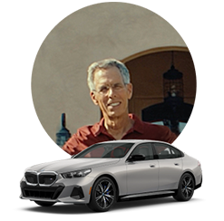 Image of John and his BMW Model.