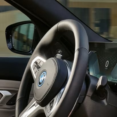 Interior shot detailing the M Sport Steering Wheel on a BMW M 330e Sedan