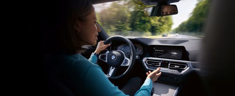 Interior shot of a woman driving a BMW