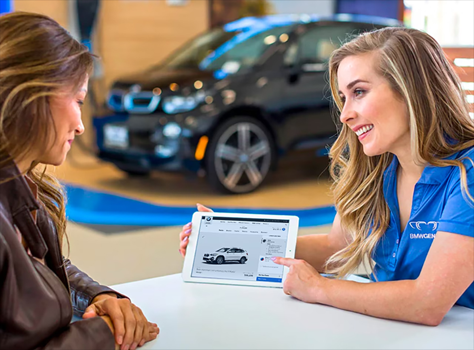 A BMW Genius worker helping a customer.