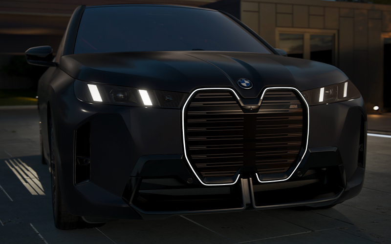 The BMW iX M70 illuminated kidney grill.