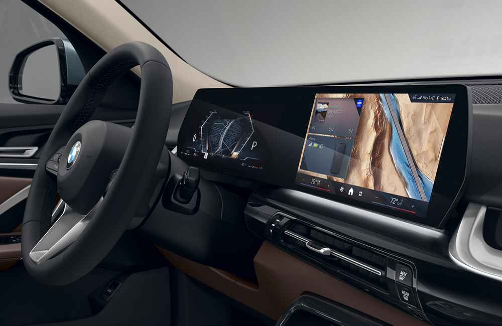 The BMW X2 Interior steering wheel and Curved
  Display.