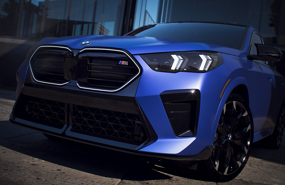 The BMW X2 M35i front view of M Shadowline Lights and Extended
  Shadowline Trim.