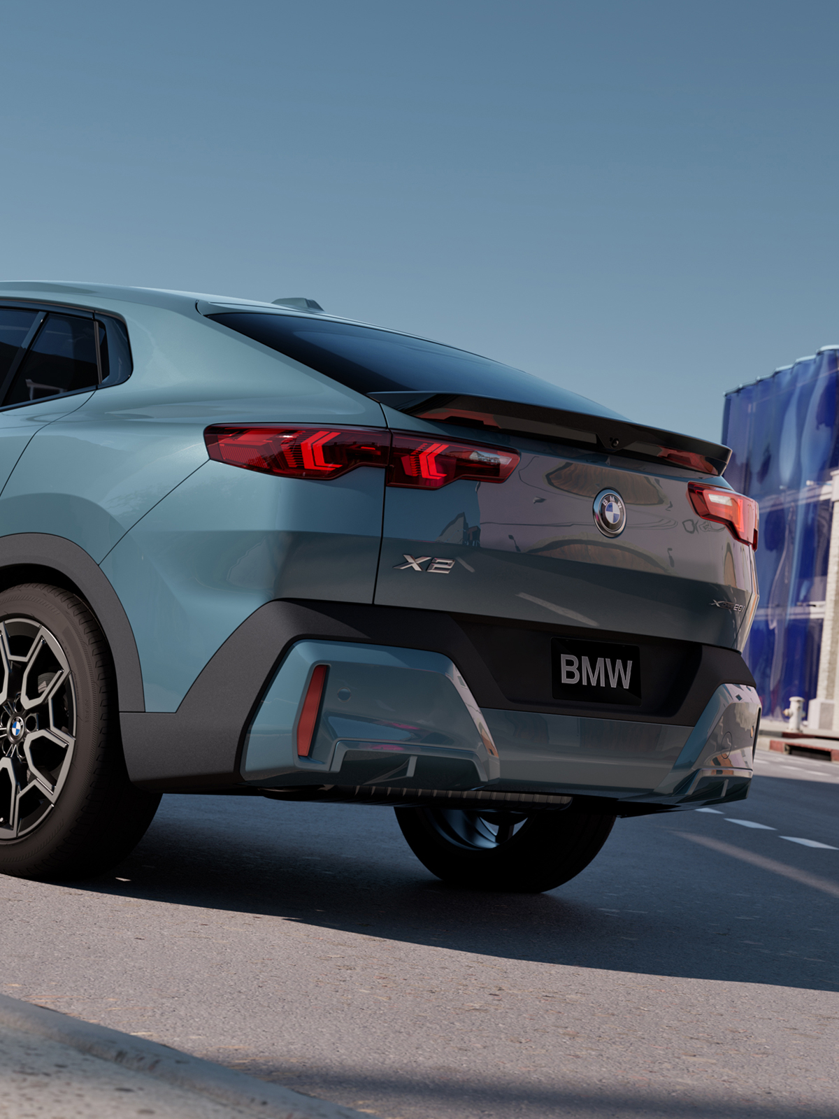 Rear view of the BMW X2 parked.
