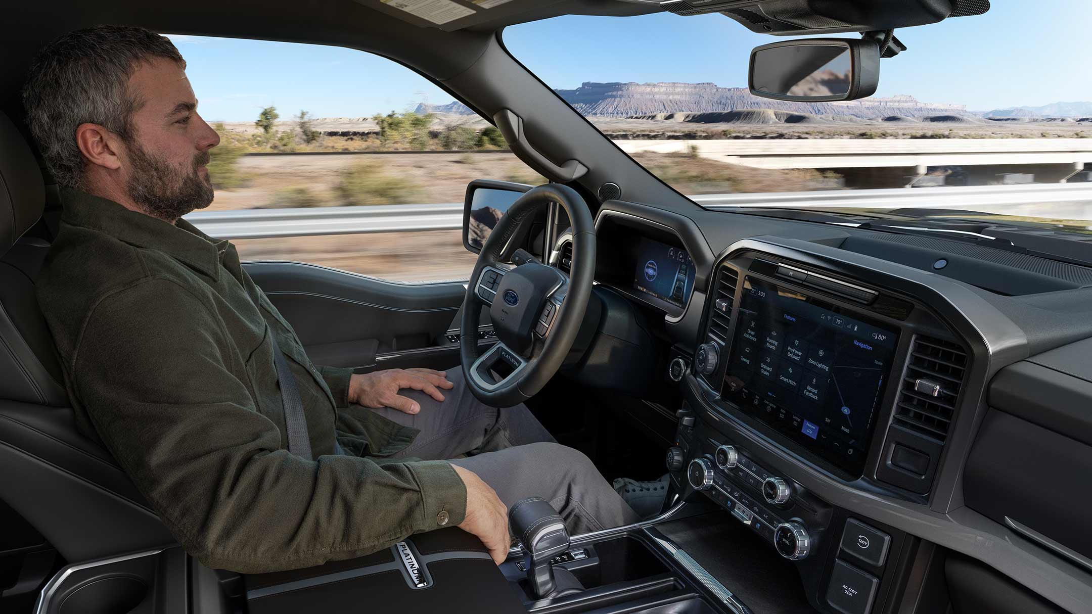 Man driving a 2025 Ford F-150® King Ranch® showing the center stack display screen
