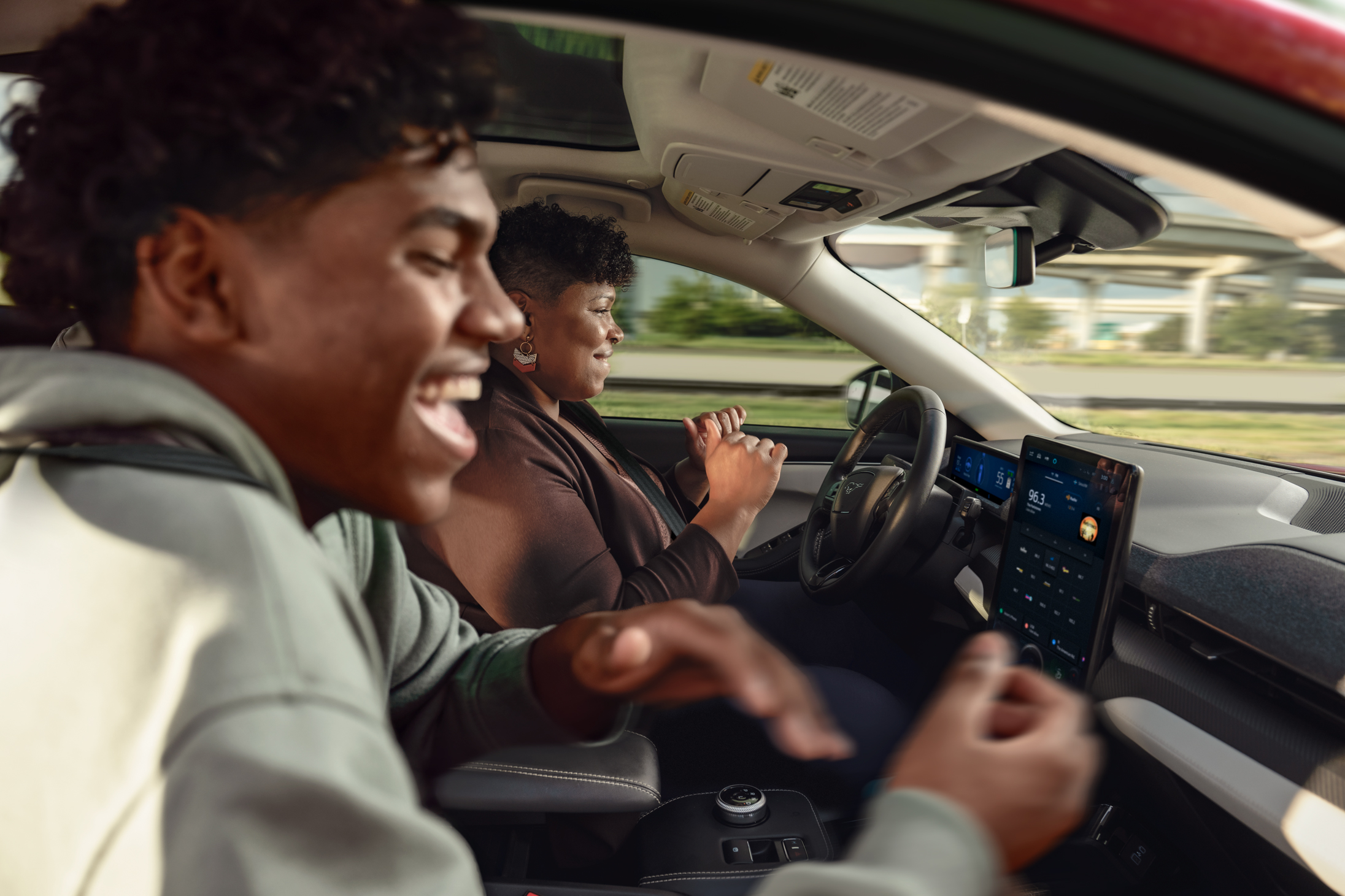 Driver and passenger enjoying the BlueCruise feature