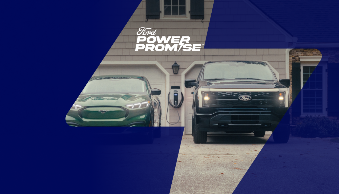 A Mustang Mach-E® and F-150 Lightning® sitting in a driveway with Ford Charge Station Pro hanging on the wall of the garage.