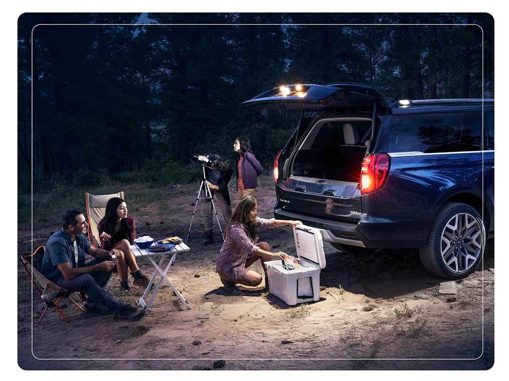 2025 Ford Expedition® Platinum® MAX SUV with available 360-Degree Zone Lighting with people nearby
