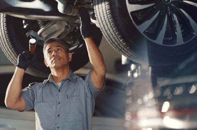Man conducting Lincoln maintenance service