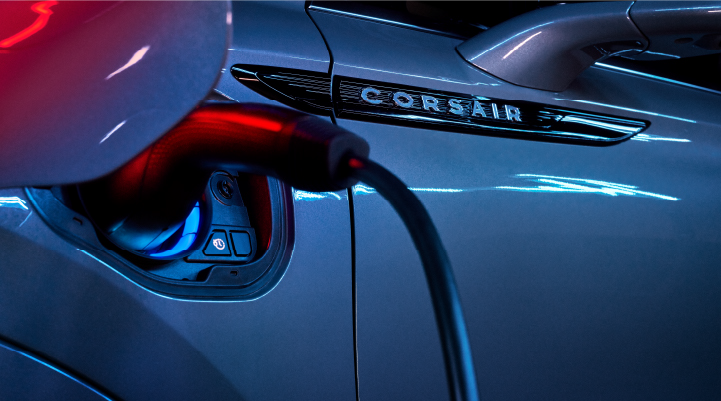 A charger plugged into the charging port of a 2025 Lincoln Corsair® Plug-in Hybrid model.