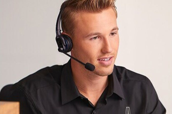 A photo of a Lincoln employee working at the Client Relationship Center.