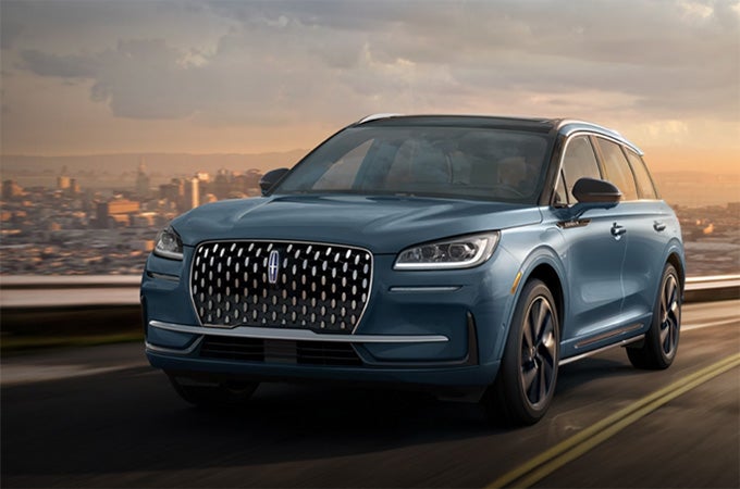 The Lincoln Corsair® SUV driving down a road