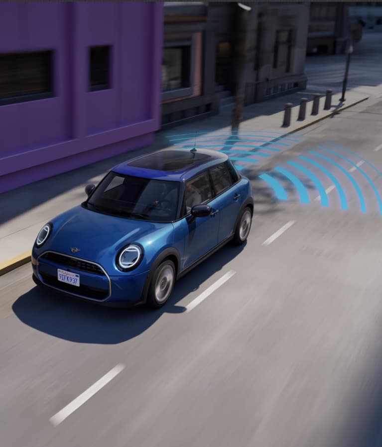 Bird’s-eye view of the MINI Cooper 4 Door surrounded by blue warning signs.