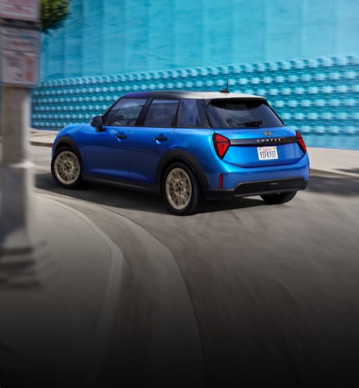 A MINI Cooper S 4 Door turns around a corner.