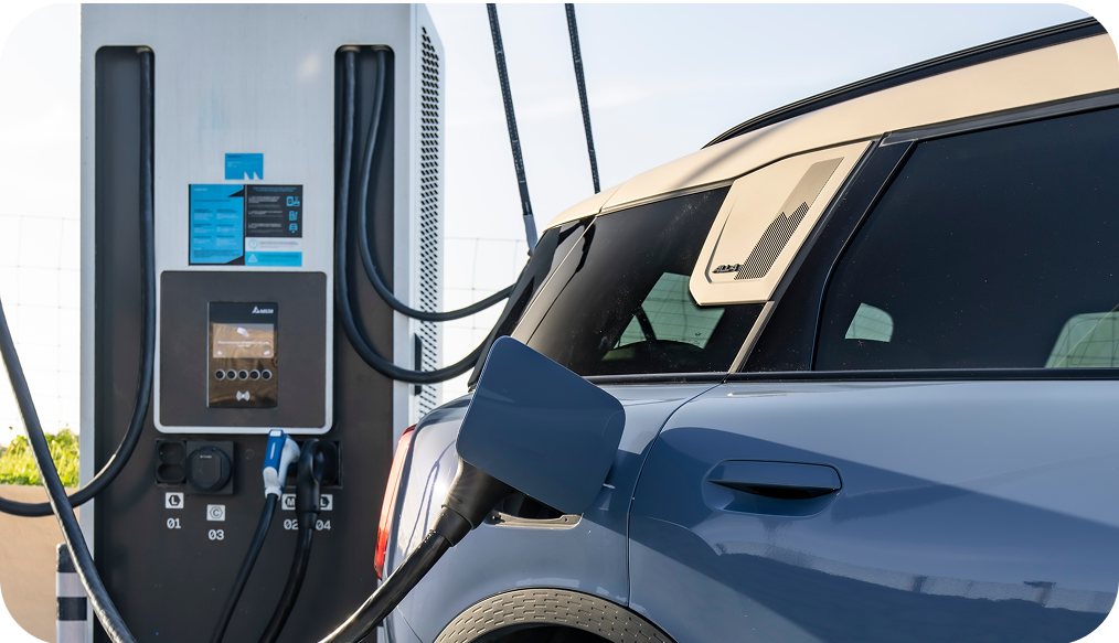 A MINI Countryman SE ALL4 charging at a charging station.
