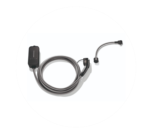 Electrical outlet on a white wall with a MINI Electric charger plugged into it.