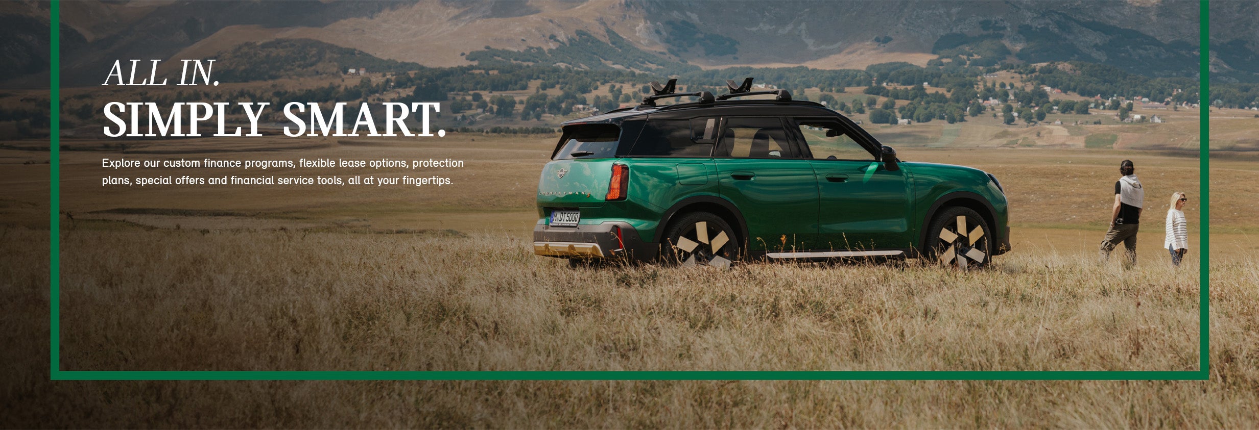 A man & woman walks away from a parked MINI