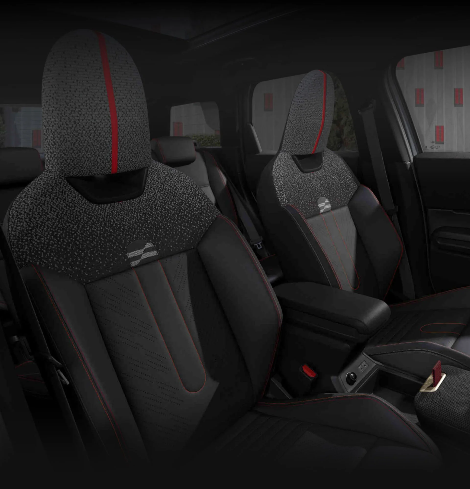 An angled-view of the inside of the MINI JCW Countryman ALL4 taken from the passenger's side showcasing the front JCW Sports Seats.