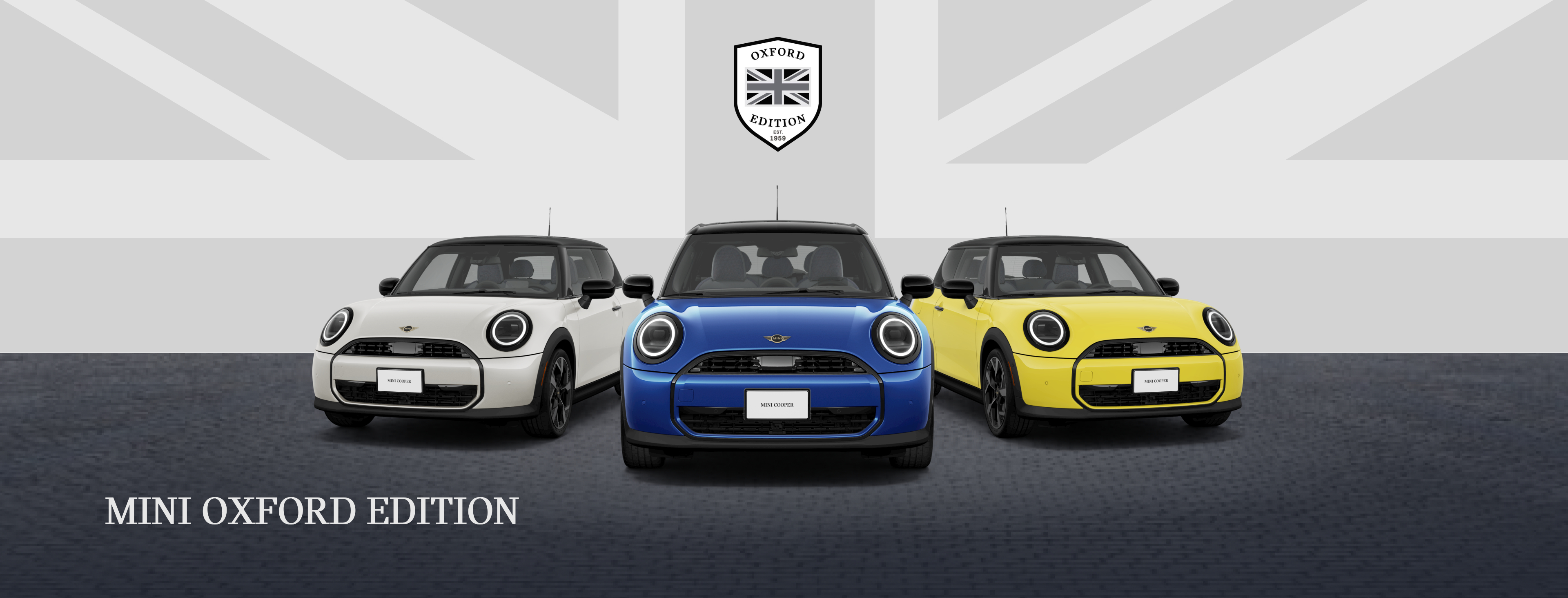  Front view of three MINI Cooper Oxford Editions parked side by side.