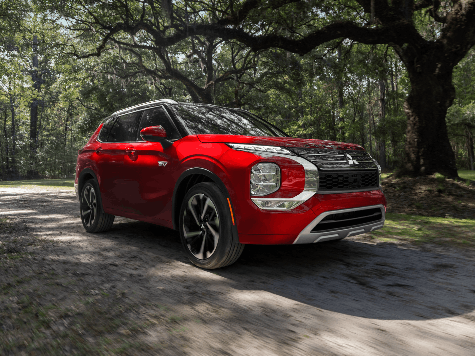 Red Mitsubishi Outlander Plug-in Hybrid low angle side profile