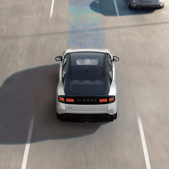 2026 Nissan Leaf on the highway in a bird's-eye view, with a blue schematic overlay demonstrating ProPILOT Assist feature.