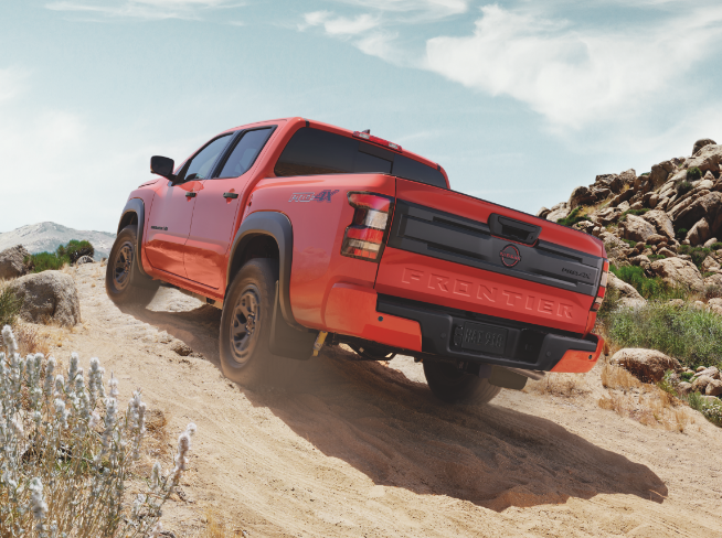 2027 Nissan Frontier PRO-4X off-roading on a desert trail
