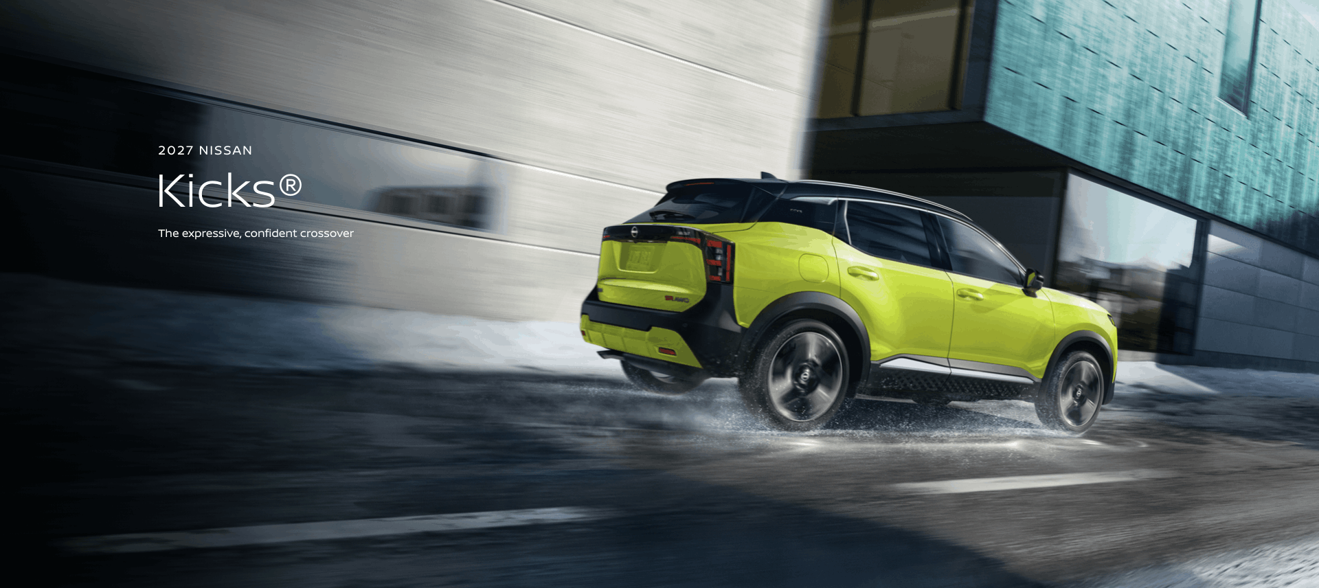 2027 Nissan Kicks in blue parked on a rooftop with modern building the background