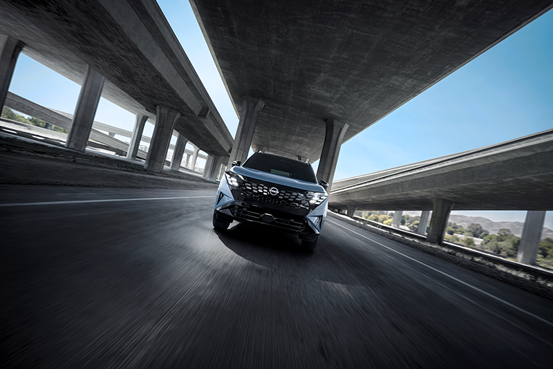 2027 Nissan Rogue Hybrid driving on the road