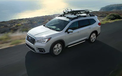 A Subaru Ascent driving on a coastal highway.