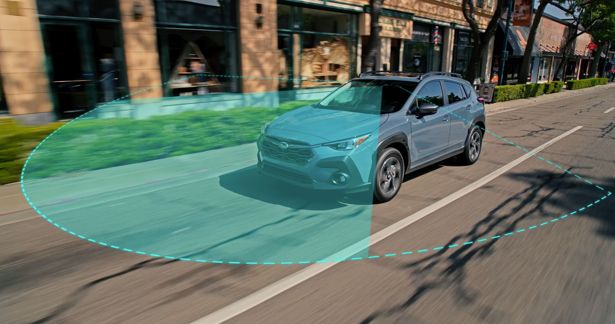 A Subaru projects an arcing line representing the Pre-Collision Braking system.
