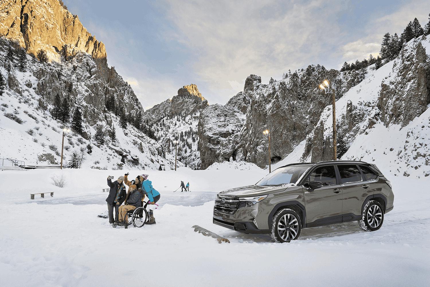 A static image of a blue 2026 Subaru Trailseeker driving on a narrow dirt trail that winds through rocky, grassy hills.