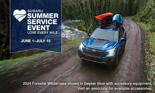 2024 Forester Wilderness shown in Geyser Blue driving on a dirt road.