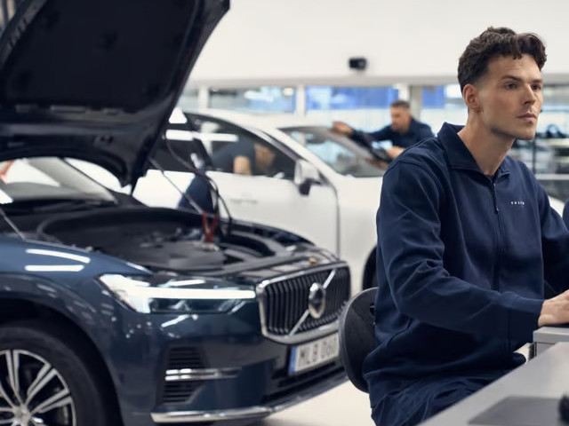 Technician running diagnostic on Volvo car