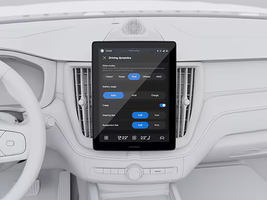 The front, side exterior of a Volvo plug-in hybrid displaying Thor’s Hammer LED headlamps in an outdoor urban setting.